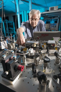 Experimental set up in RAL Space's Laser Spectroscopy Laboratory at STFC's Rutherford Appleton Laboratory on 5th February 2016. Image shows Dr Neil Macleod adjusting the ACLaS remote sensing natural gas instrument.